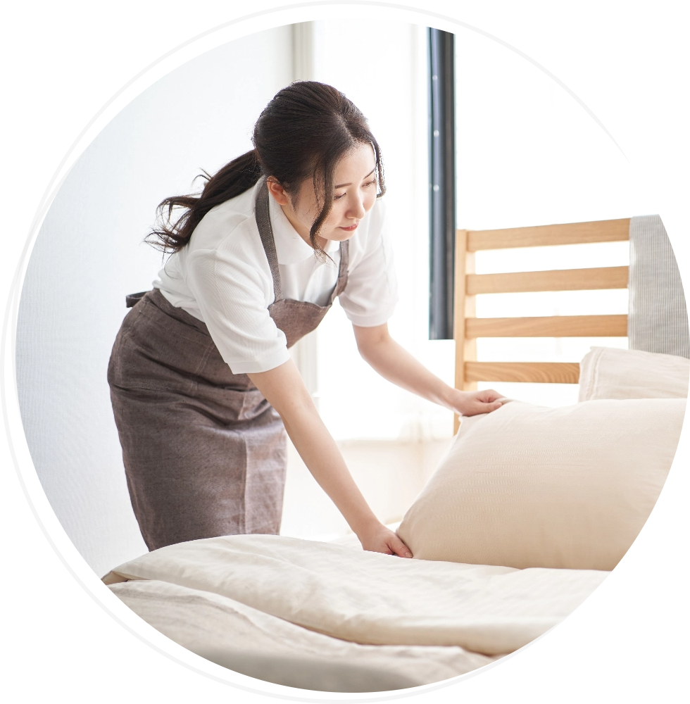 a housekeeper straightening a pillow